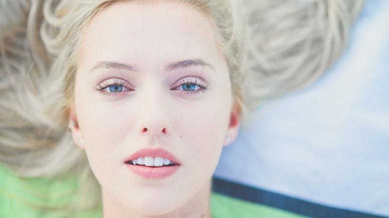 Woman with pale skin posing