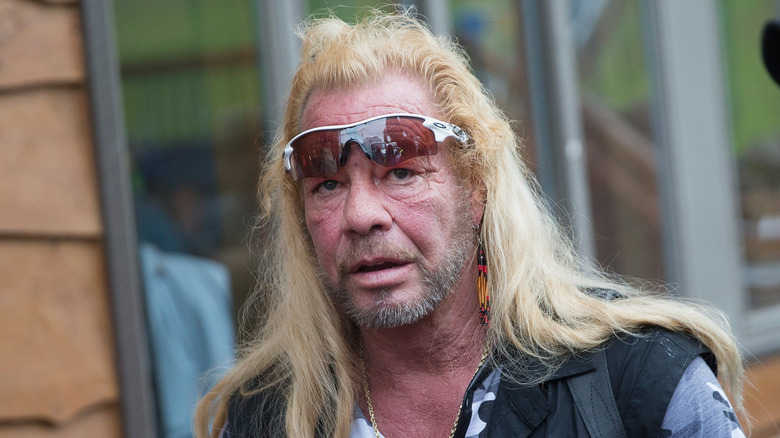 Dog the Bounty Hunter walking down the street