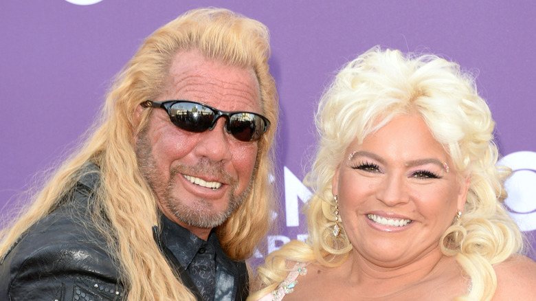 Dog the Bounty Hunter and Beth Chapman pose for a photo
