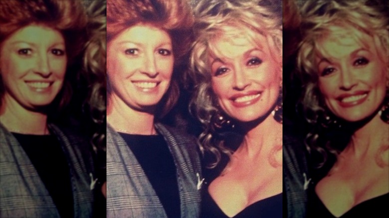 Judy Ogle in plaid jacket with Dolly Parton