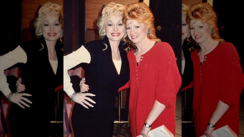 Dolly Parton in black and white dress with Judy Ogle in red dress