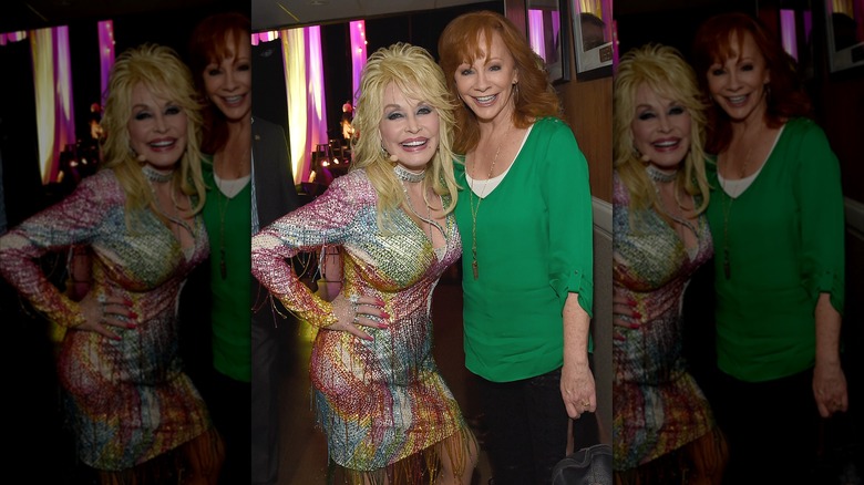 Dolly Parton in colorful sequin dress with Reba McEntire green top