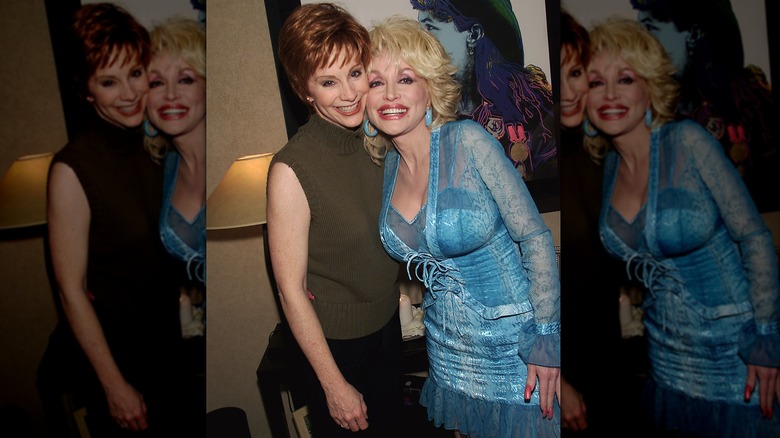 Reba McEntire short hair with Dolly Parton blue lace dress 2001