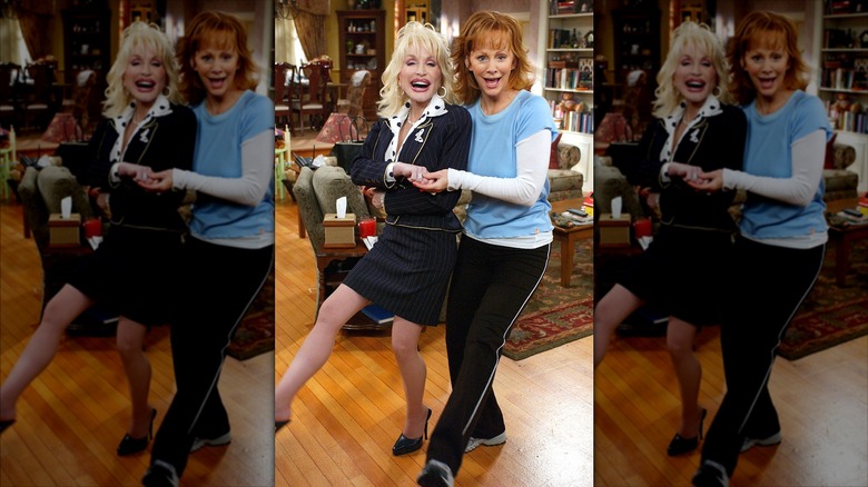 Dolly Parton and Reba McEntire doing kicks on the set of 'Reba'