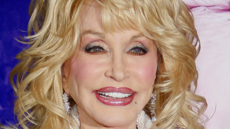 Dolly Parton big hair pink lipgloss