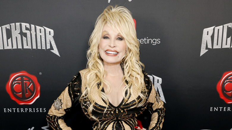 Dolly Parton smiling at a red carpet event