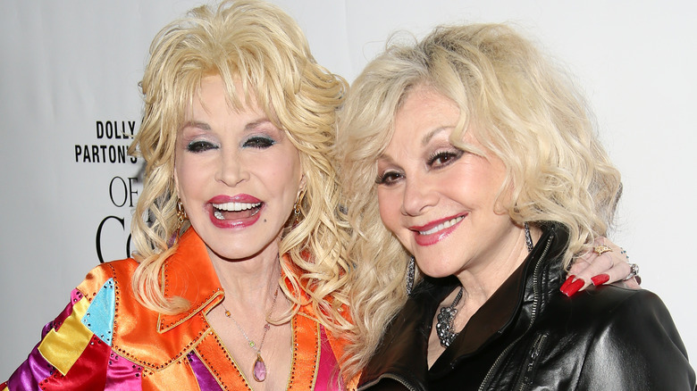 Dolly Parton and Stella Parton smiling at the camera