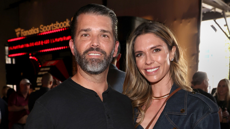 Don Jr. and Bettina Anderson smiling while posing at an event together