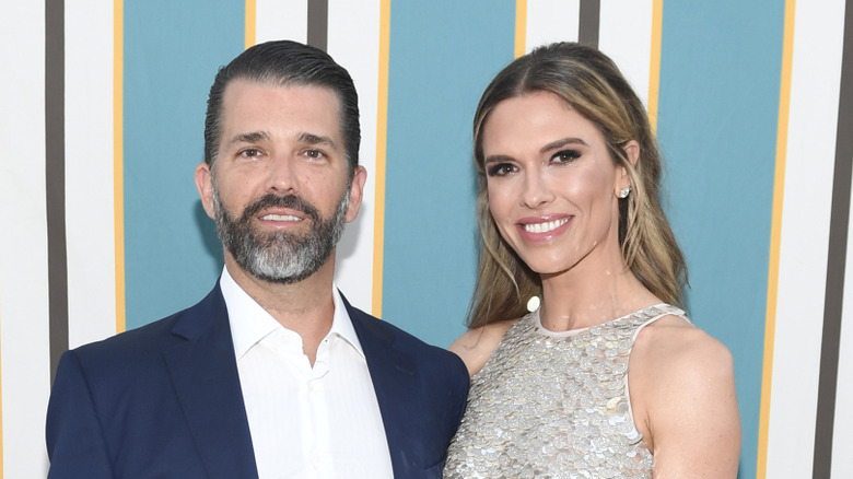Bettina and Don Jr. smile on a red carpet