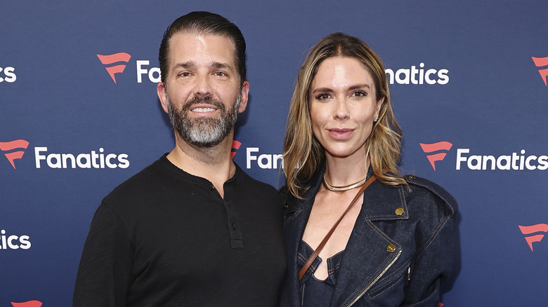 Bettina Anderson and Don Jr. posing on a red carpet