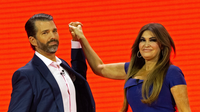 Kimberly Guilfoyle and Don Jr. awkwardly hold hands
