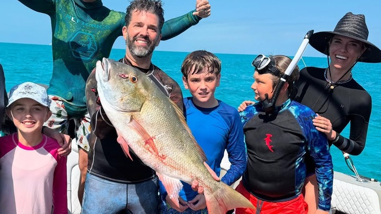 Don Jr. and Bettina spearfishing with three of his kids