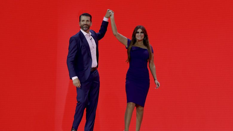 Donald Trump Jr. and Kimberly Guilfoyle holding hands