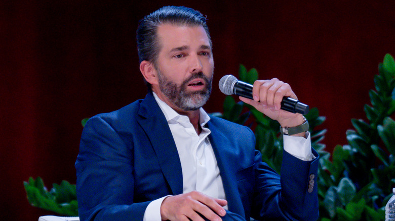 Donald Trump Jr. speaking into microphone