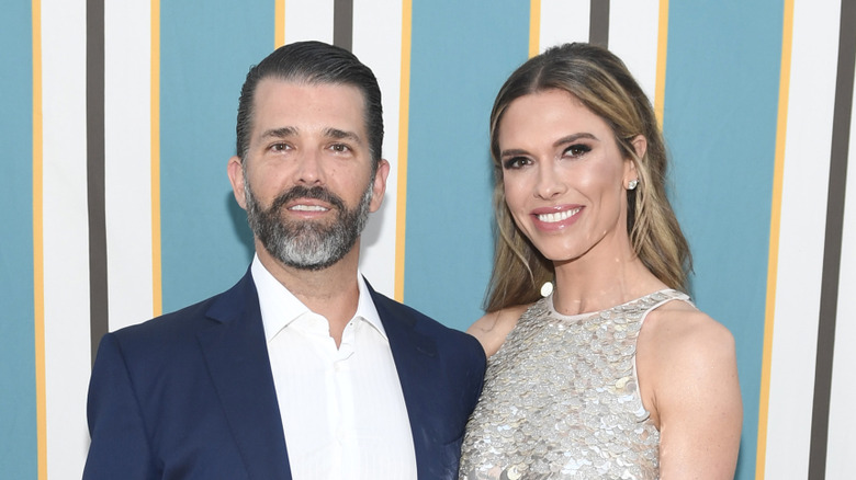 Bettina Anderson smiling while posing at an event with Donald Trump Jr.