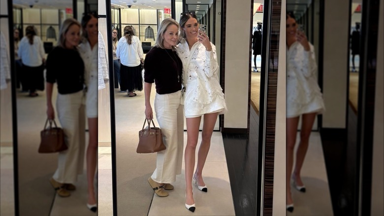 Bettina Anderson taking mirror selfie with friend