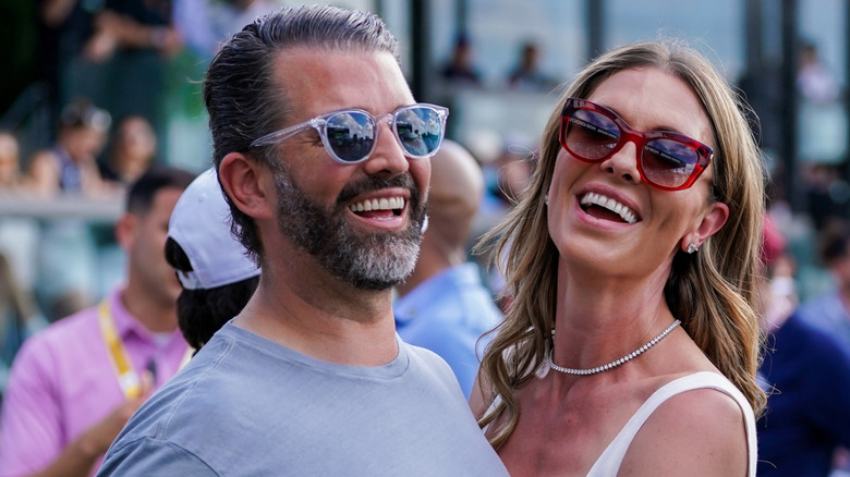 Donald Trump Jr. and Bettina Anderson sunglasses laughing
