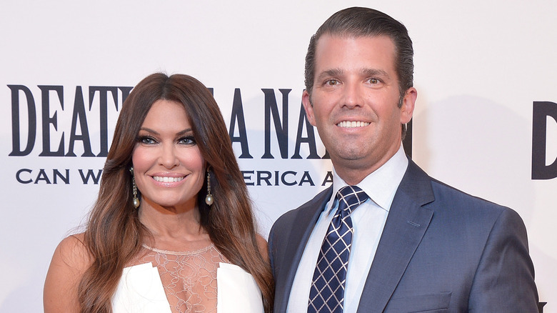 Kimberly Guilfoyle smiling with Donald Trump Jr.