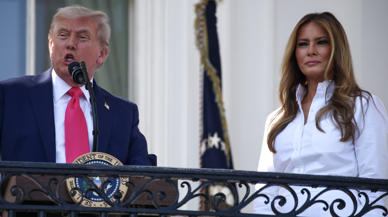 Donald and Melania Trump standing far apart