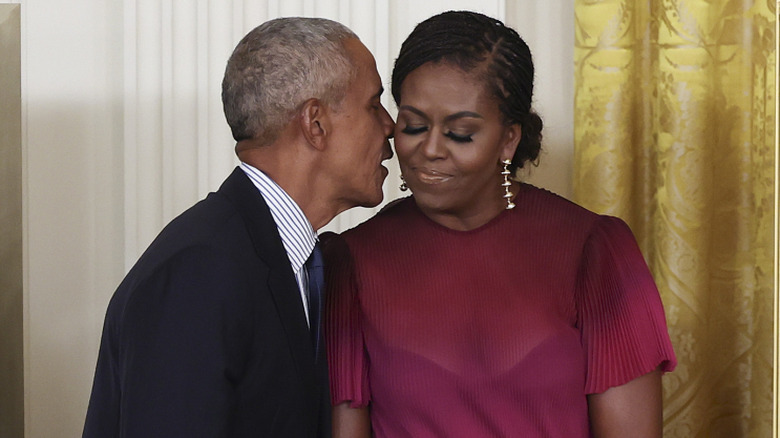 Michelle and Barack Obama standing on stage at the Democratic National Convention.