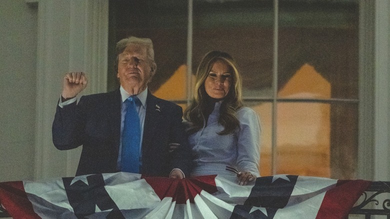 Donald and Melania Trump standing on the White House balcony
