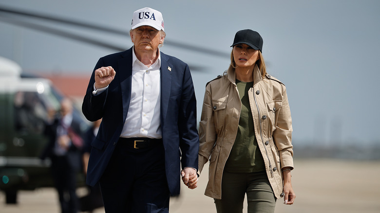 Donald and Melania Trump walk hand in hand