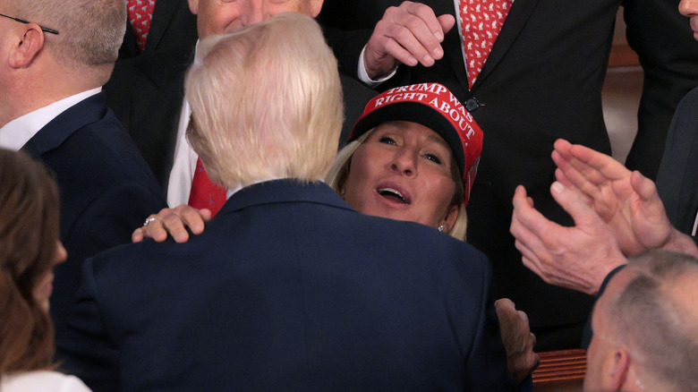 Donald Trump hugging Marjorie Taylor Greene at the State of the Union