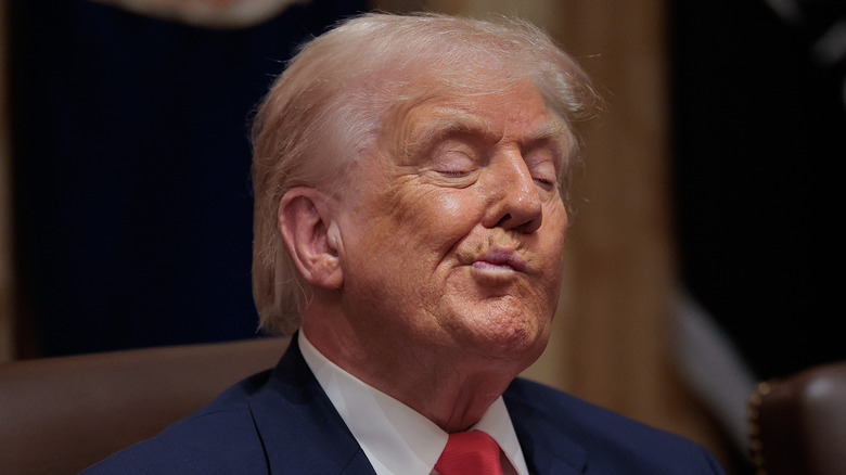 Donald Trump pursed lip smirk