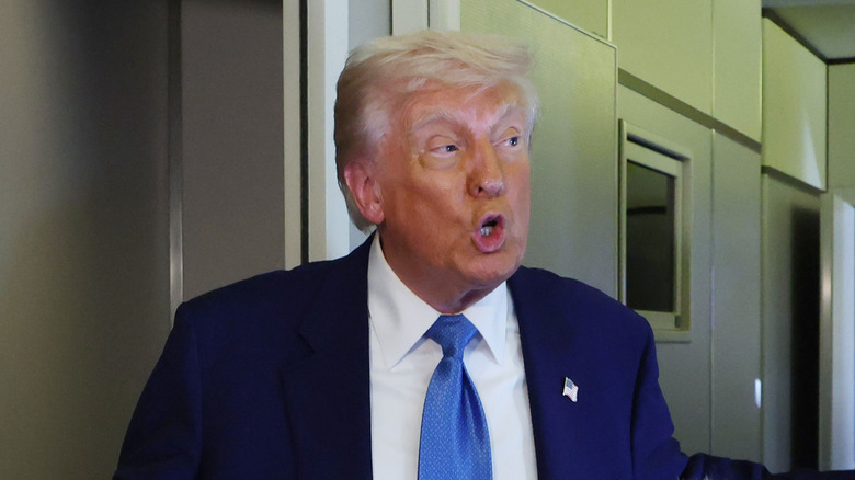 Donald Trump speaking to reporters on Air Force One