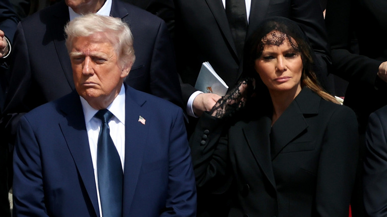 Donald and Melania Trump standing next to each other