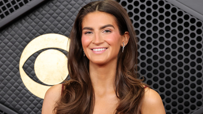 A photograph of Kaitlan Collins where she is, in fact, smiling at an event