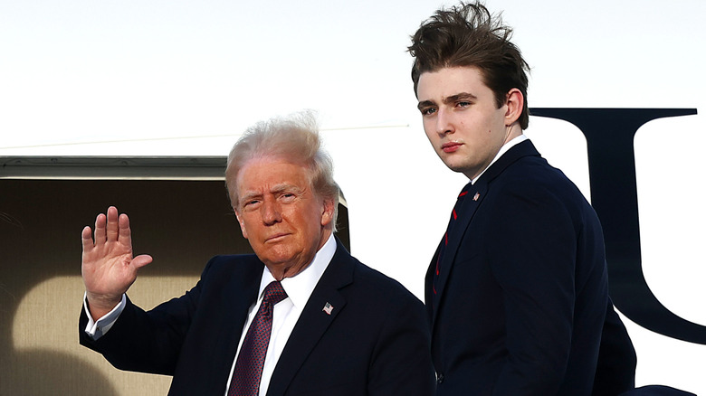 Donald Trump waving next to Barron Trump