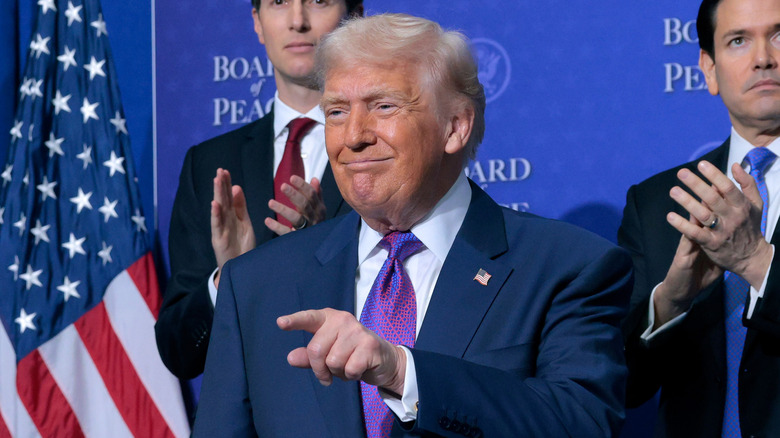 Donald Trump standing in front of the American flag, Jared Kushner, and Marco Rubio