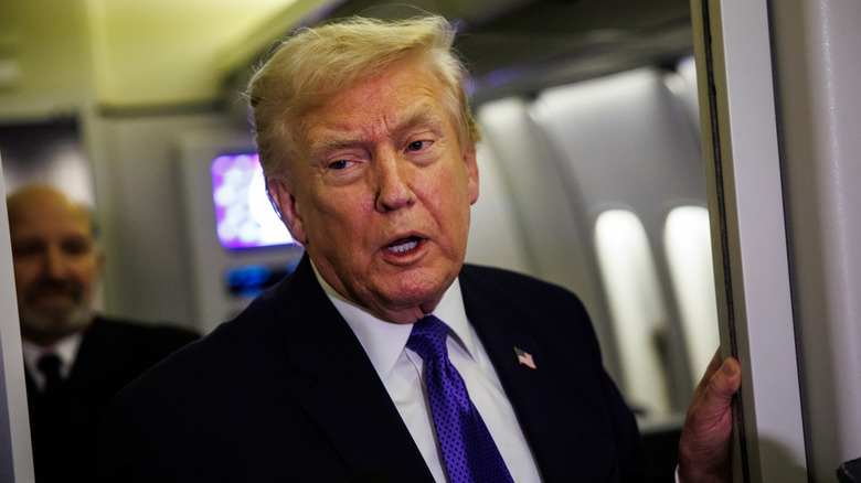 Donald Trump speaking to reporters on Air Force One