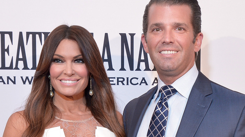 Kimberly Guilfoyle and Donald Trump Jr. smile side by side