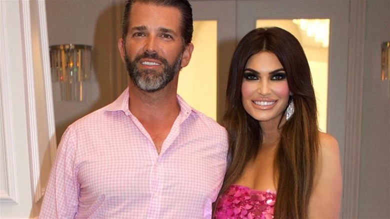 Donald Trump Jr. and Kimberly Guilfoyle smiling side by side