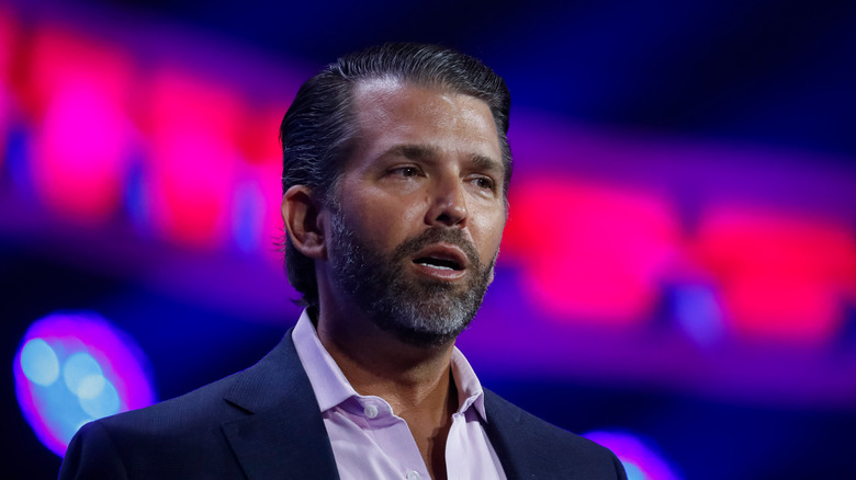 Donald Trump Jr. speaks at a podium 