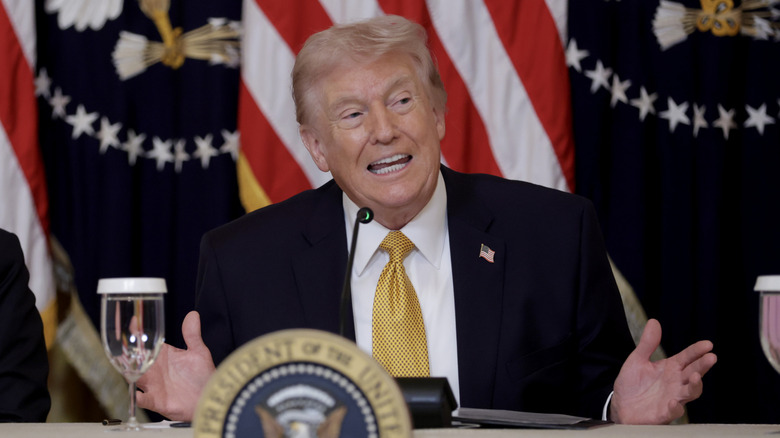 Donald Trump giving a speak with his hands extended