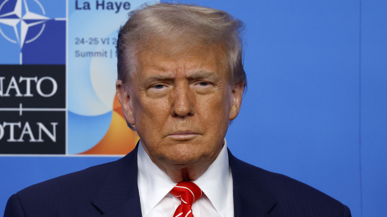 Donald Trump frowning at NATO conference