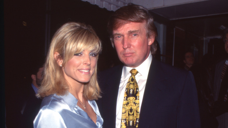 Marla Maples smiling and Donald Trump looking serious