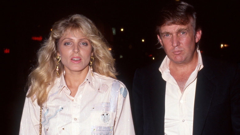 Marla Maples with her mouth open and Donald Trump looking unhappy