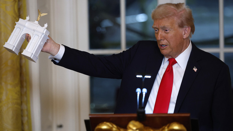 Donald Trump showcasing a model of the Independence Arch