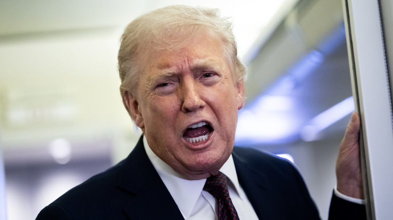 Donald Trump scowling mouth open on AF One