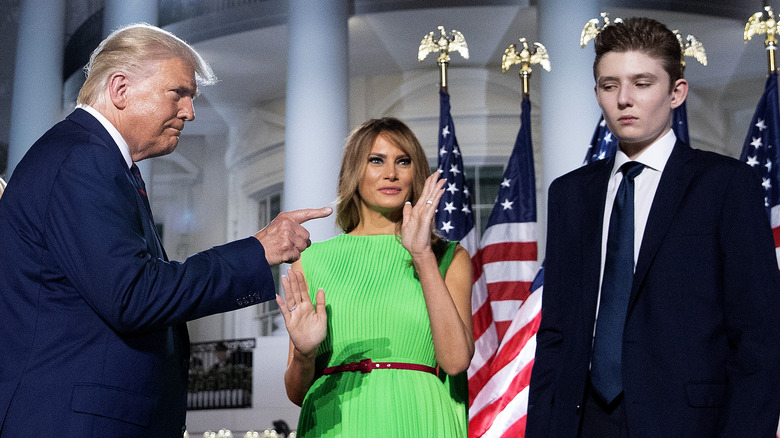 Donald Trump pointing at Barron in front of White House