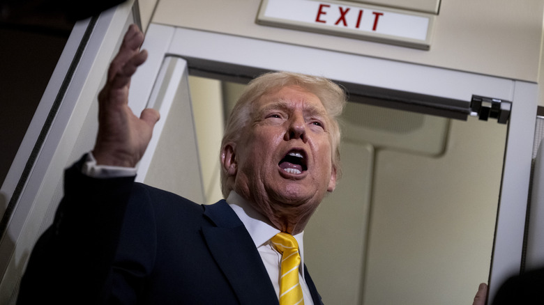 Donald Trump speaking to reporters on Air Force One