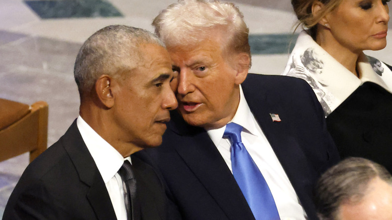 Donald Trump whispering to Barack Obama