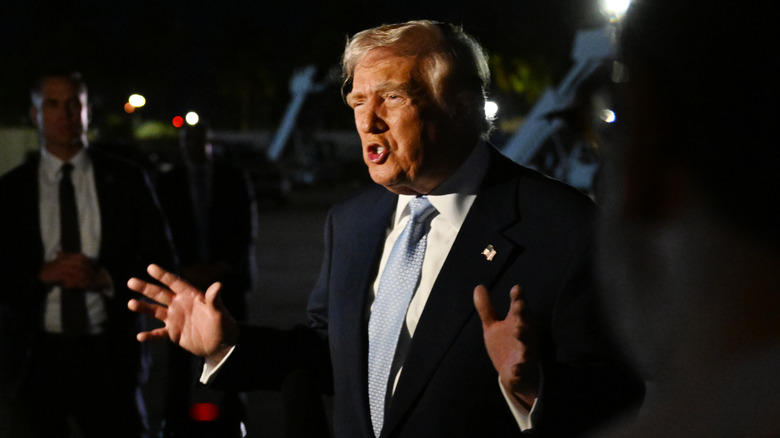 Donald Trump speaking to reporters outside of Air Force One