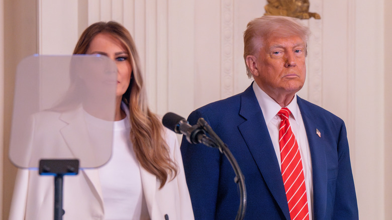 Donald and Melania Trump standing next to each other