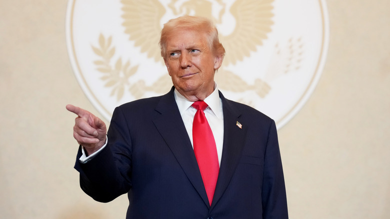 Donald Trump pointing at an event in Japan