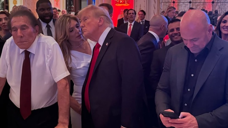 Marla Maples whispers in Donald Trump's ear